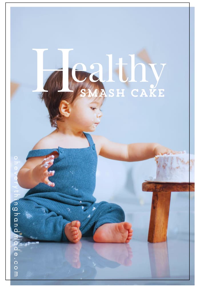 A baby’s smash cake moment with “Healthy Smash Cake” text overlay on a blue backdrop, with creamy frosting on a small wooden stool.